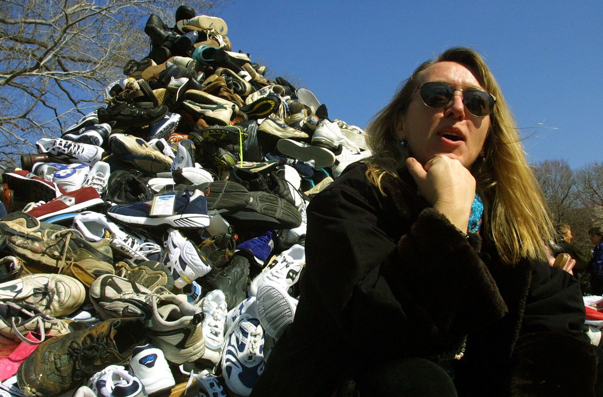 Jody Williams sits in front of donated shoes symbolizing landmine victims during Ban Landmines Week on March 8, 2001, on Capitol Hill in Washington. Williams and the International Campaign to Ban Landmines won the Nobel Peace Prize in 1997.  