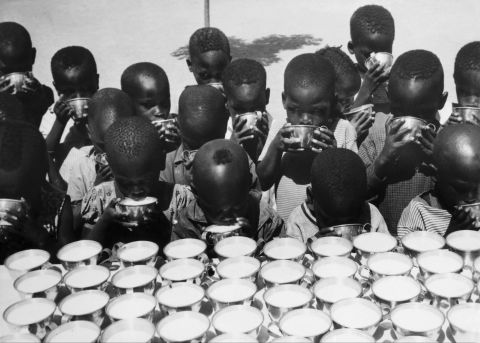Children drink milk handed out by UNICEF workers in Moundou, Chad, on October 26, 1965. UNICEF won the Nobel Peace Prize in 1965. 
