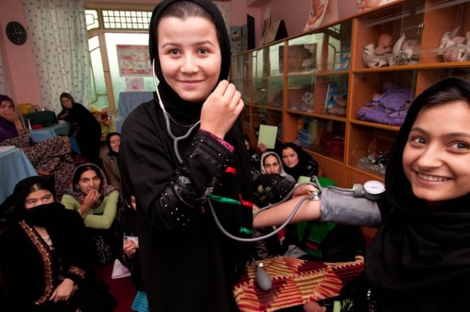 Soliha practises measuring blood pressure in an Afghan Turk clinic in Taloqan, north of Afghanistan. Along with a class of 20 young village women, she spends 18 months training to become a midwife. After qualifying, they return to their remote villages. In a country whose child mortality rates are the highest in the world and where many women die in pregnancy, their skills will save lives and enable women to deliver babies safely.