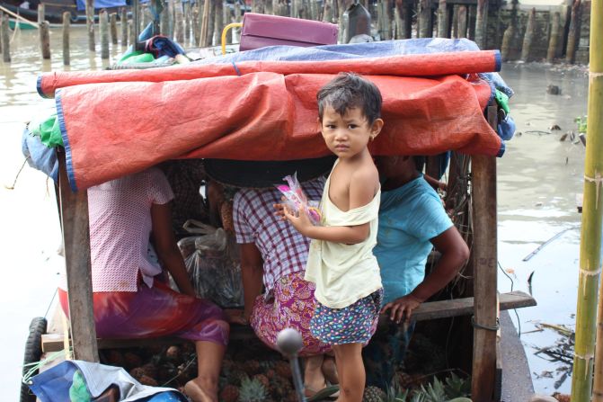 This young girl is with her family on a boat in Bogale, but Cyclone Nargis created many other young orphans. Boys separated from their families are easy targets for army recruiters because few people will miss them.