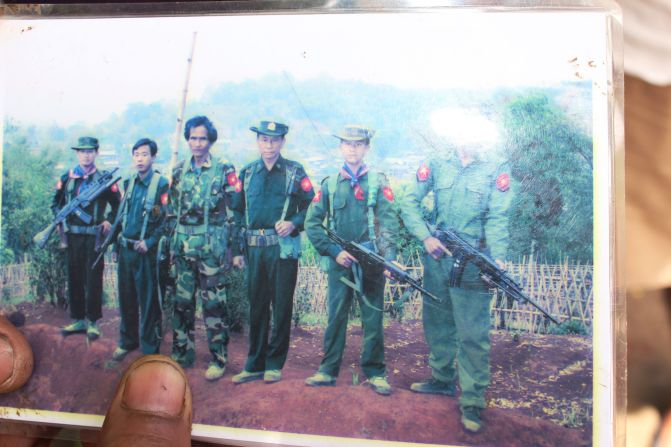 In this photo, Soe Paing's son Zaw Zaw Lin stands second from the right. He wears a Myanmar military uniform and holds a gun. Zaw Zaw Lin spent more than three years in the army before he was freed.