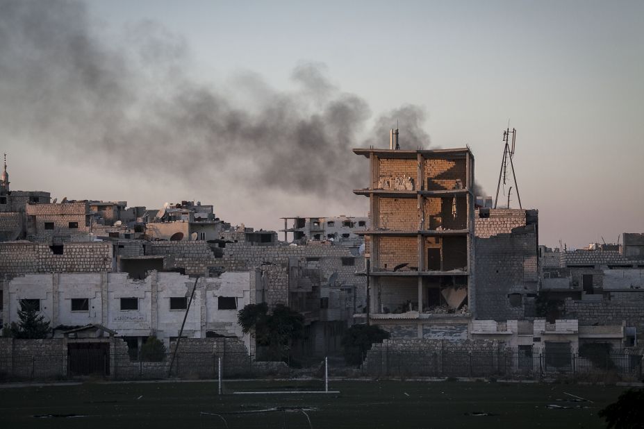 Smoke rises after a mortar shell hit a residential area during fighting between Syrian government forces and rebels in Maaret al-Numan, Syria, on October, 9.