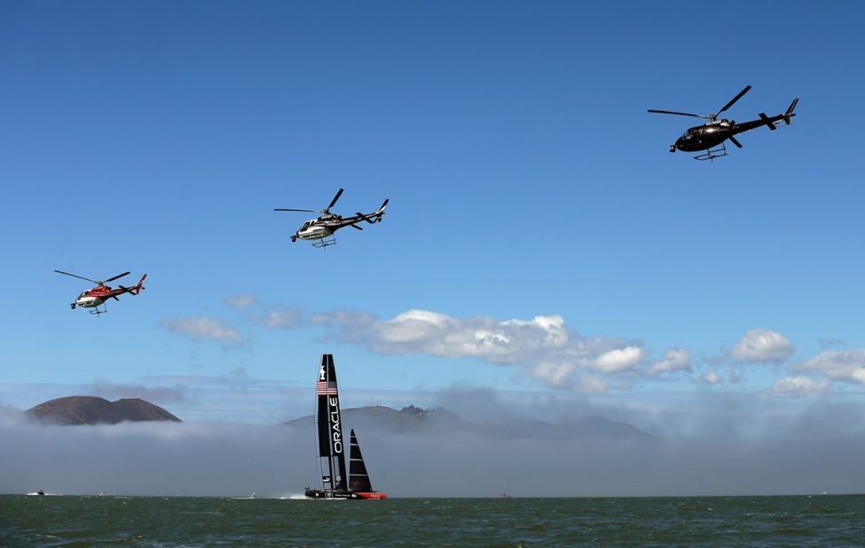 Veteran sports photographer Ezra Shaw took to land, sea, and sky to capture these remarkable images of the America's Cup. "Before each race, both teams would warm up by sailing most of the race course," the 39-year-old Getty photographer explained. "The television helicopters would also start the day by flying in a close formation across the course."
