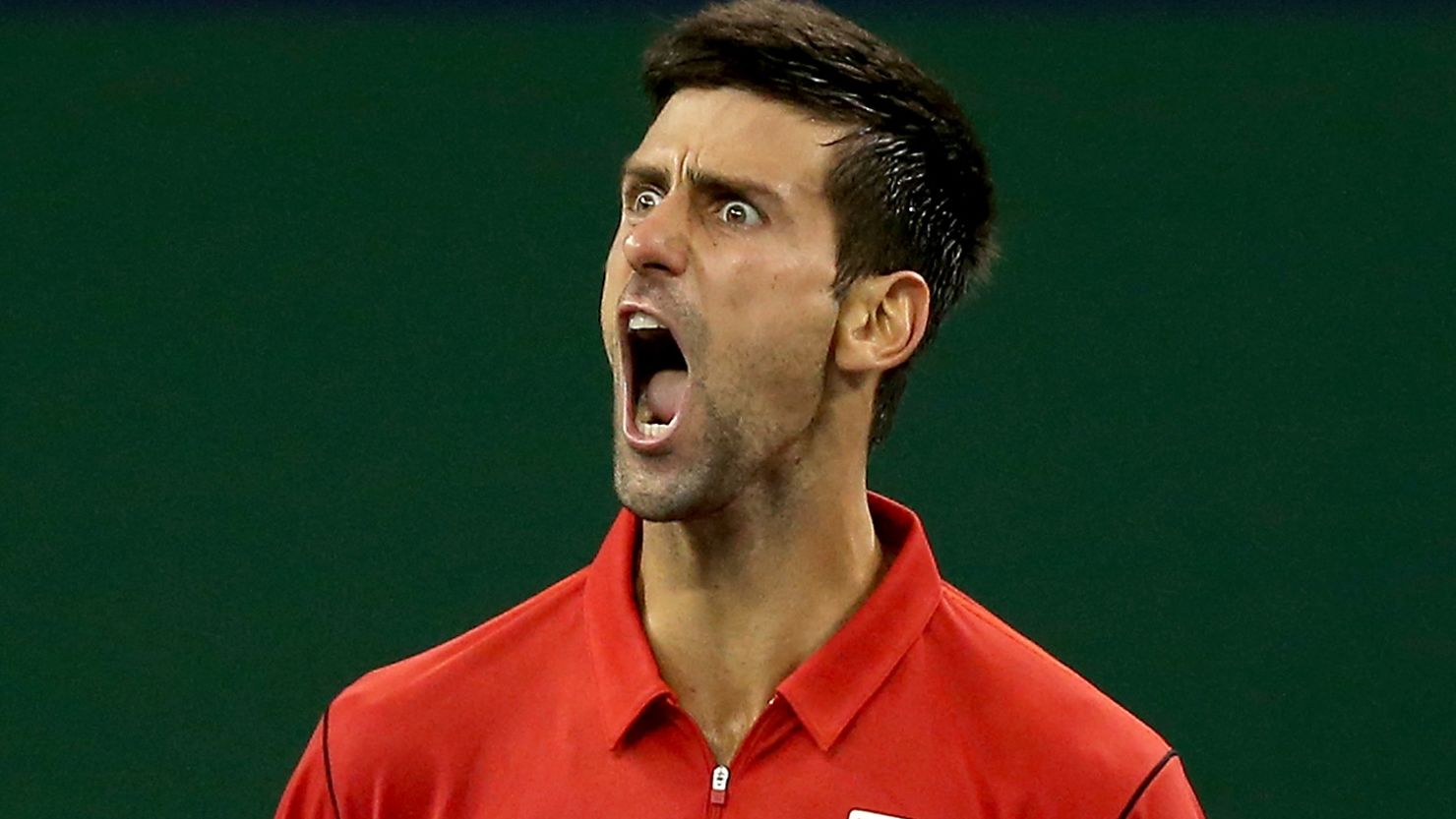 Novak Djokovic strikes a typical pose after closing out Gael Monfils in their Shanghai Masters quarterfinal.