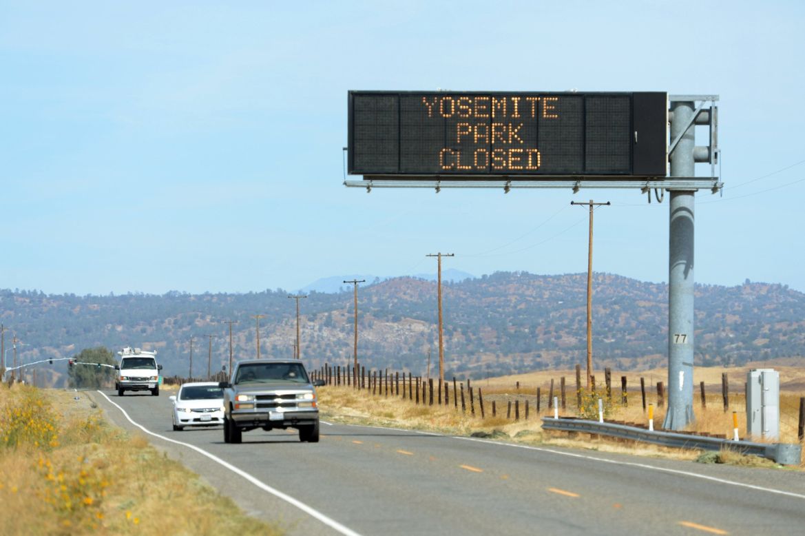 A sign on Highway 41, north of Fresno, California, tells motorists about the closure of Yosemite Park on October 1.
