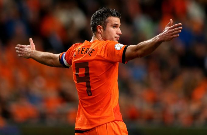 Robin van Persie scored a hat-trick in an 8-1 thrashing of Hungary by his Dutch team who have topped Group D.