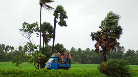 Evacuees leave the village of Sanabandha, India, on October 12.