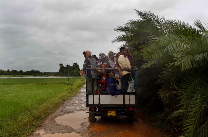 A small truck takes villagers to a cyclone shelter in Podampeta on October 12. 