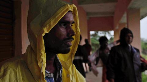 An man takes shelter at a school near Berhampur on October 12.