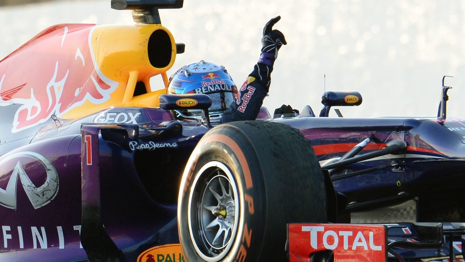 Sebastian Vettel gives his trademark victory salute after a superb drive to win the Japanese Grand Prix at Suzuka.