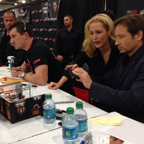 "X-Files" stars Gillian Anderson and David Duchovny -- here taking a photo of a fan's diorama -- <a href="http://t.co/1dMT9oa3iu" target="_blank" target="_blank">reunited</a> for the show's 20th anniversary.