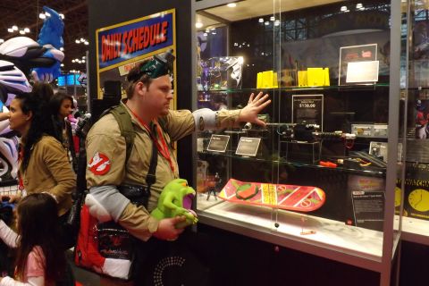 Oh, those tempting toy booths. This <a href="http://ireport.cnn.com/docs/DOC-1047657">Ghostbuster </a>eyes an item at the Mattel booth.
