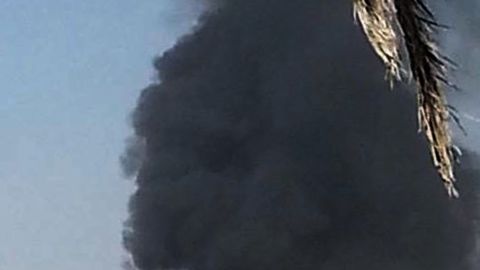 Smoke billows from the site of a car bomb explosion in the central Iraqi city of Kut on October 13.