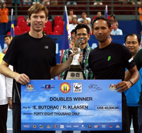 Eric Butorac (left) with doubles partner Raven Klaasen after winning the Malaysian Open title. Butorac has paid close attention to diet during his long career. 
