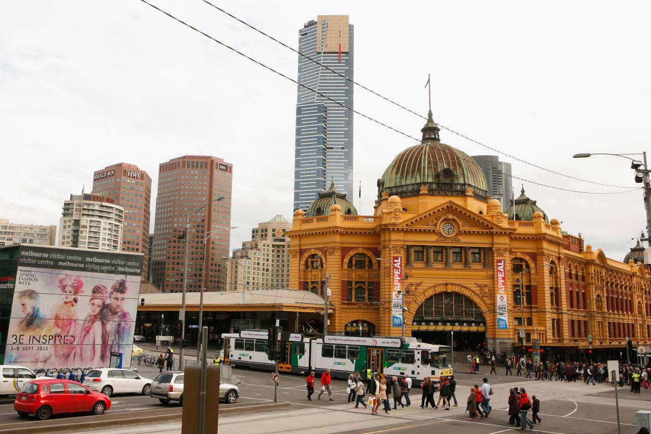 The classy yellow facade and green copper dome of Flinders Street Station in Melbourne, Australia. The century-old structure is  the busiest suburban railway station in the southern hemisphere with 110,000 commuters passing through each day, according to the City of Melbourne.
