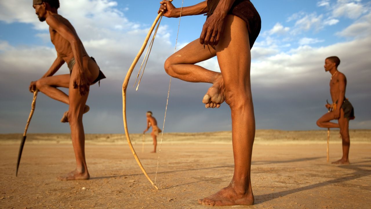 Men from the Khomani San community strike traditional poses in South Africa's Kalahari Desert. The desert is also home to a space shuttle emergency landing strip, a 4.9-kilometer-long runway at Upington Airport.