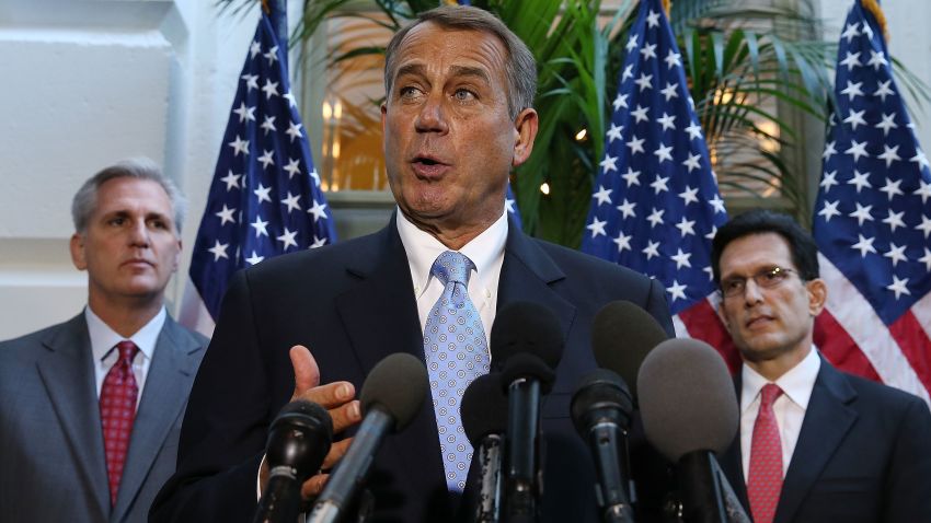 House Speaker John Boehner speaks to the media while flanked by House Majority Leader Eric Cantor, right, and Rep. Kevin McCarthy following a House Republican caucus meeting at the Capitol in Washington on October 15, 2013.