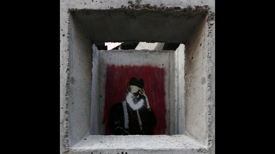 Banksy's "Concrete Confessional" is seen on the Lower East Side of Manhattan.