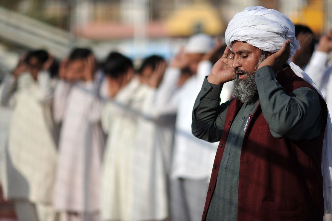 Muslims pray in an open-air basketball field in the city of Corinth, near Athens, Greece, last year.