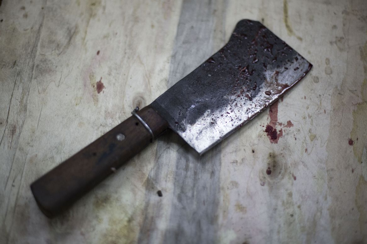 A blood-stained cleaver sits on a block after an animal was slaughtered in downtown Cairo on October 15.