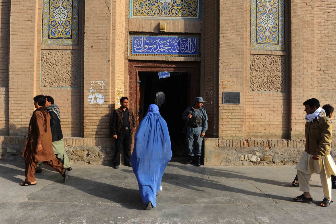An woman walks to the Jame mosque before prayers in Herat, in western Afghanistan, on October 15.
