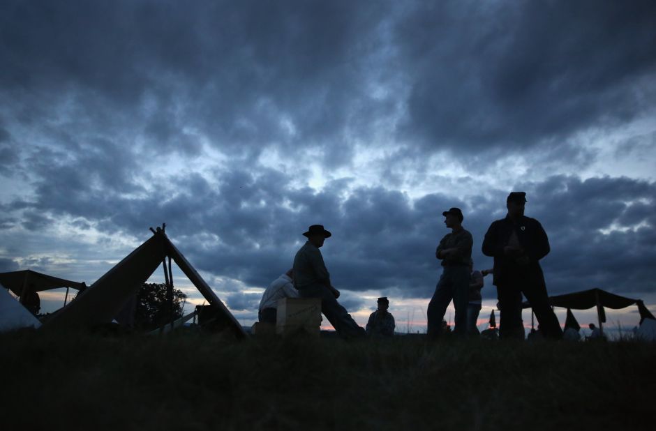 Union Civil War re-enactors await nightfall while camped at the Gettysburg National Military Park on the 150th anniversary of the historic battle on July 1, 2013. One Gettysburg-related ghost tour is offered by a former park ranger. 