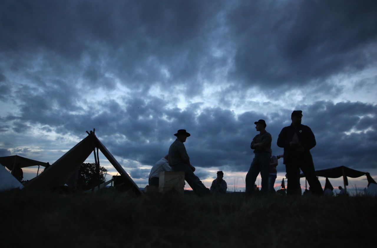 Union Civil War re-enactors await nightfall while camped at the Gettysburg National Military Park on the 150th anniversary of the historic battle on July 1, 2013. One Gettysburg-related ghost tour is offered by a former park ranger.