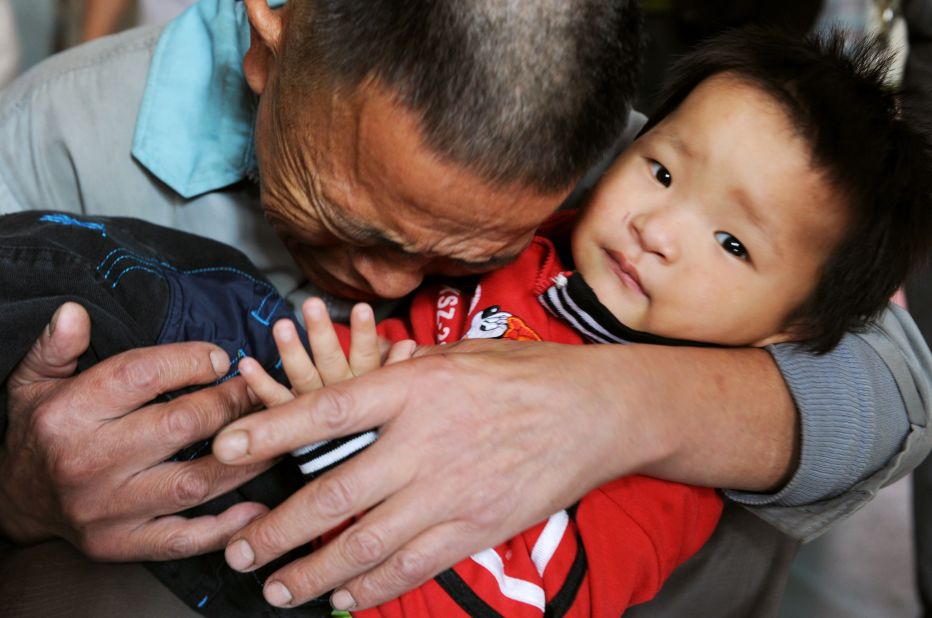 Wang Bangyin breaks down as he hugs his rescued son at a welfare center for children in China's Guizhou province in 2009. The boy was among 60 children rescued by police from human traffickers. Nearly 3 million people in China are victims of forms of modern slavery, including forced marriage, sexual exploitation and forms of forced labor such as domestic servitude, forced begging and forced marriage.