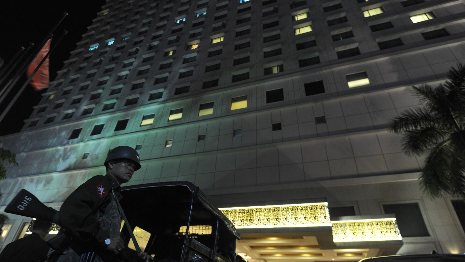 A soldier stands guard outside the Traders Hotel in Yangon on October 14 after it was rattled by a bomb.