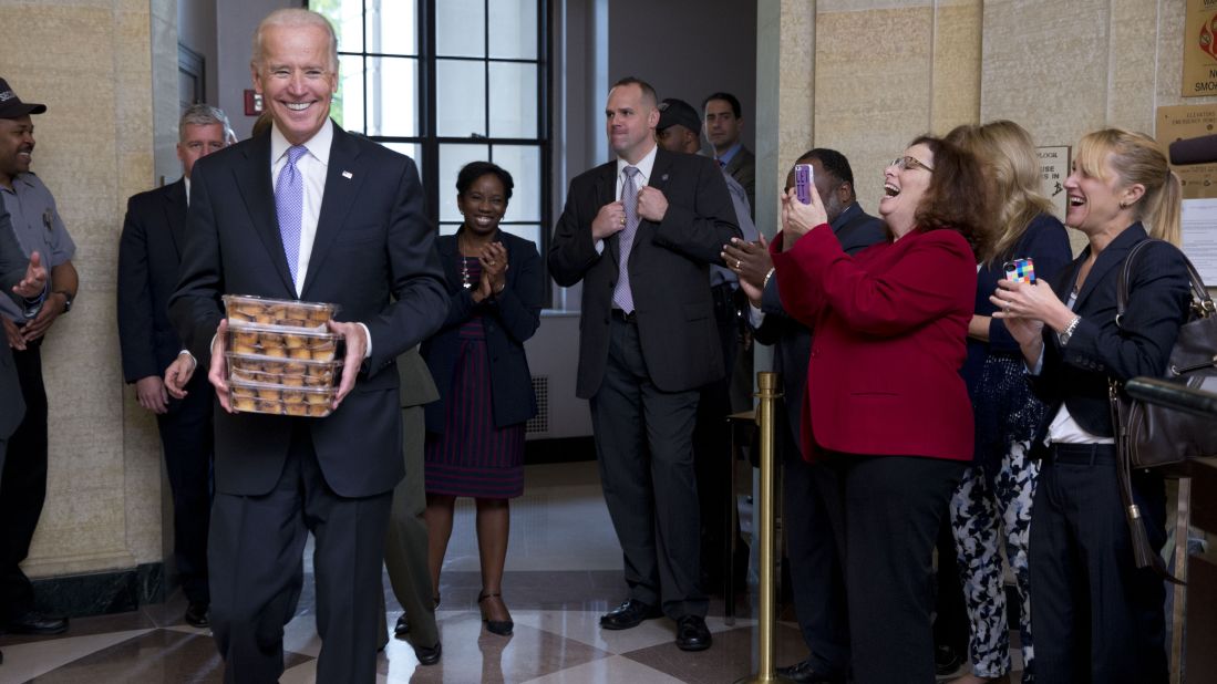 Vice President Joe Biden greets Environmental Protection Agency workers with muffins at the Clinton Federal Building in Washington as they return to work October 17.