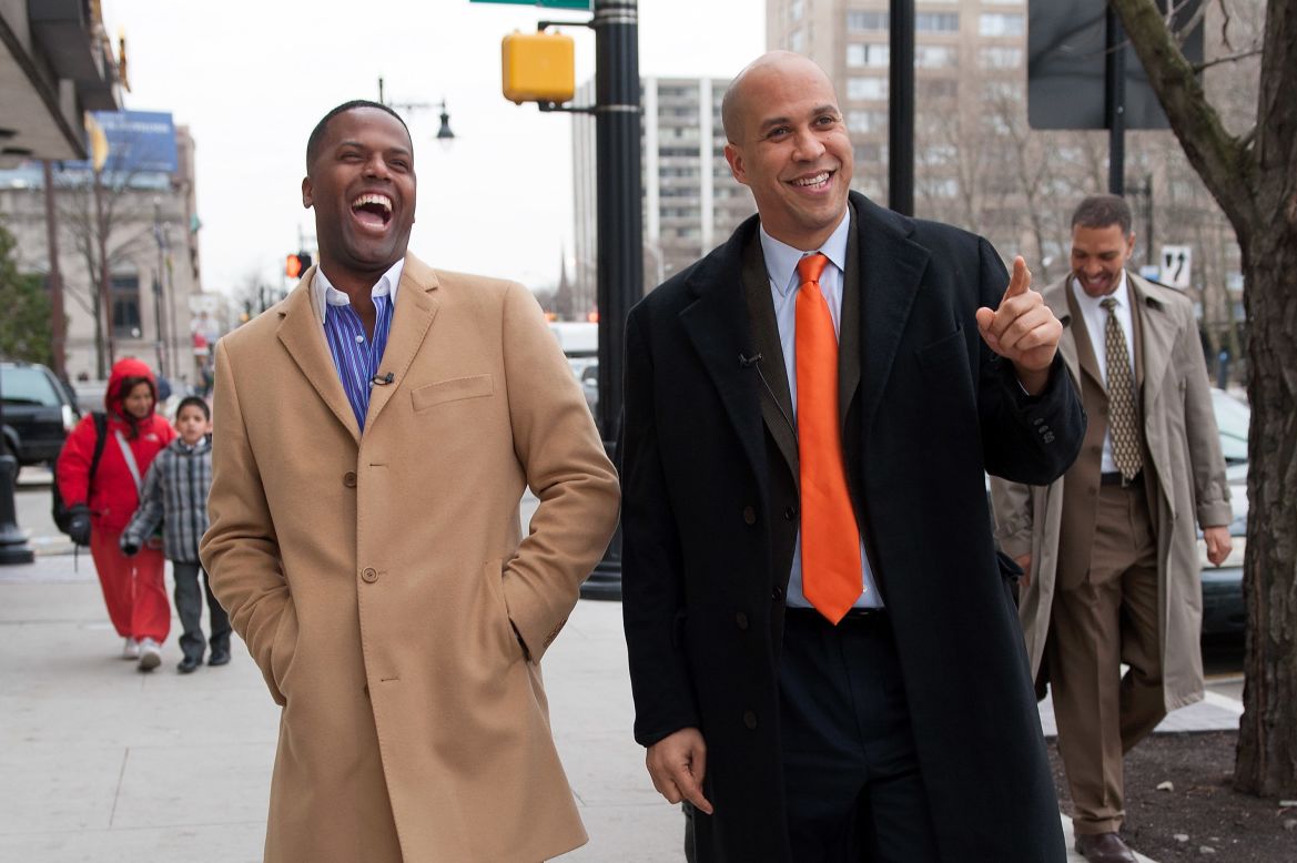 Booker and television personality A.J. Calloway walk the streets of Newark during a taping of "Extra" on January 15.