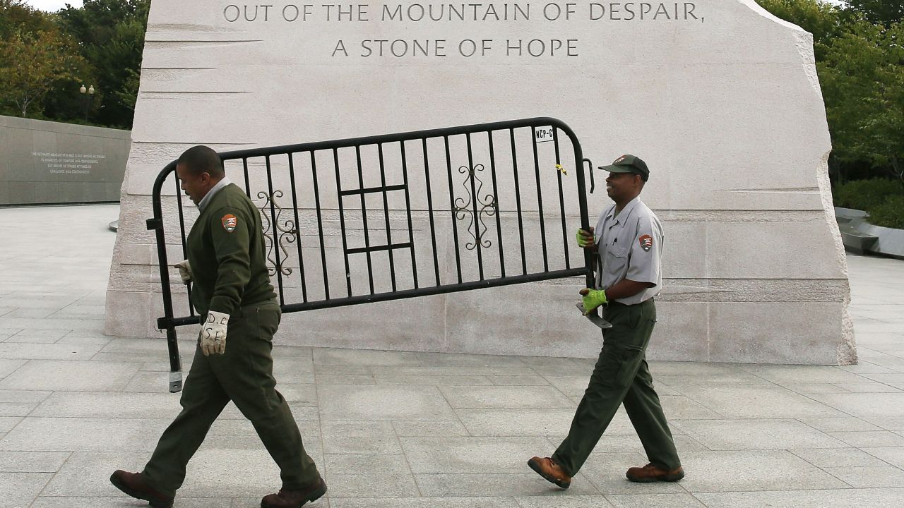 U.S. Park Service workers remove a barricade from the Martin Luther King Jr. Memorial in Washington on October 17.