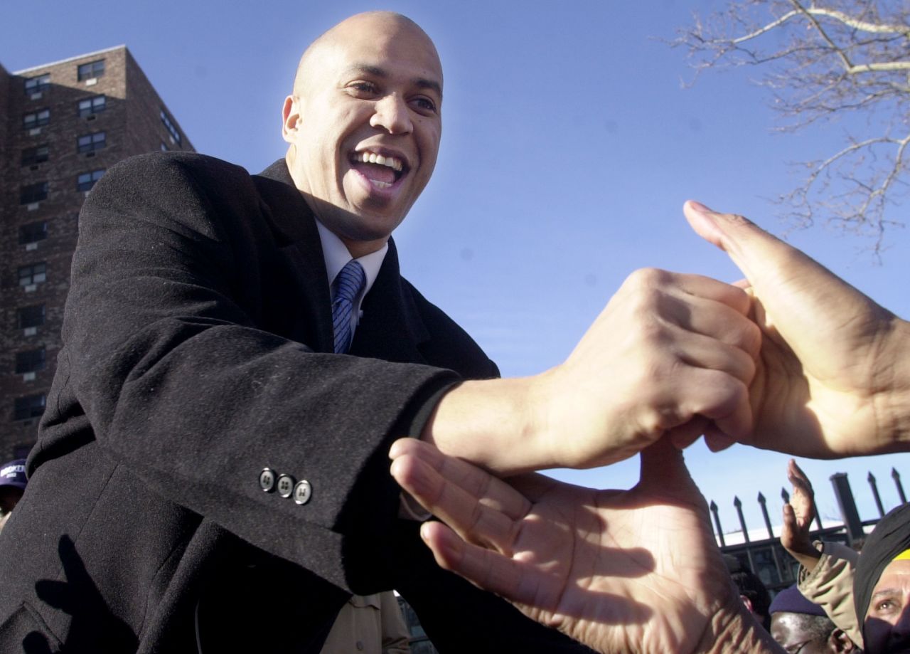 Booker reaches out to supporters in January 2002 as he declares his candidacy for mayor in Newark. He lost that election to incumbent Sharpe James.