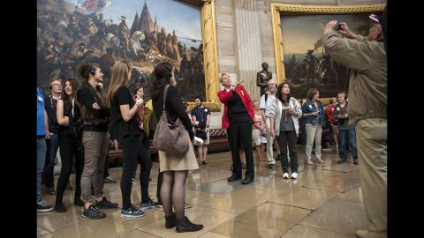 A tour guide leads tourists through the U.S. Capitol Rotunda on October 17.