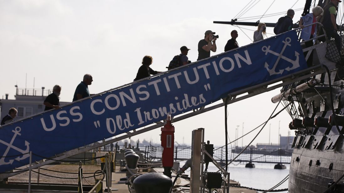 Visitors to the U.S.S. Constitution walk up the gangplank for a tour in Boston on October 17.