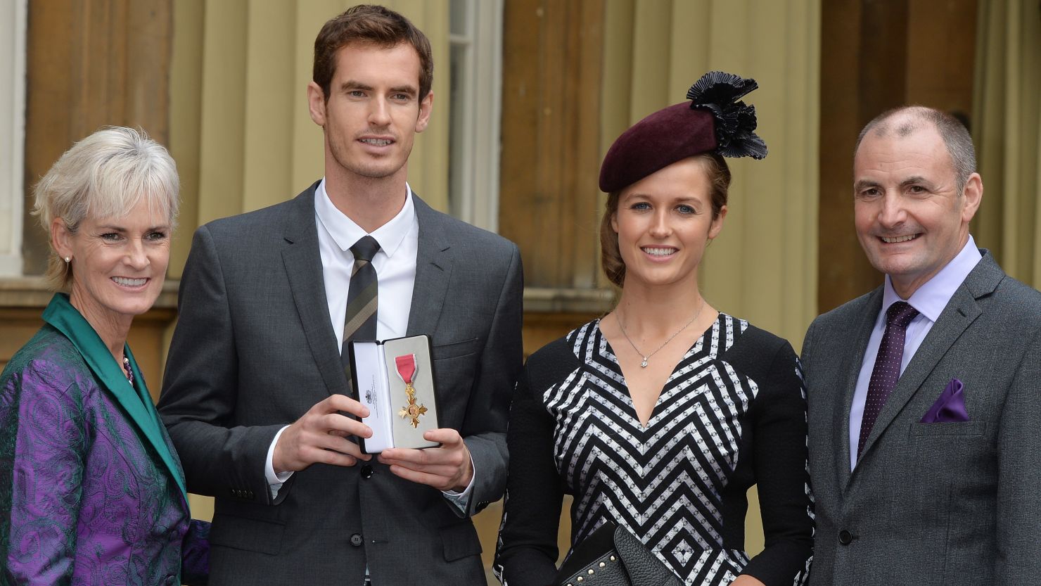 Andy Murray, second from left, received an OBE Thursday in front of his girlfriend and parents.  