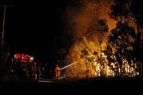 Firefighters fought scores of bush fires in New South Wales early on October 18.