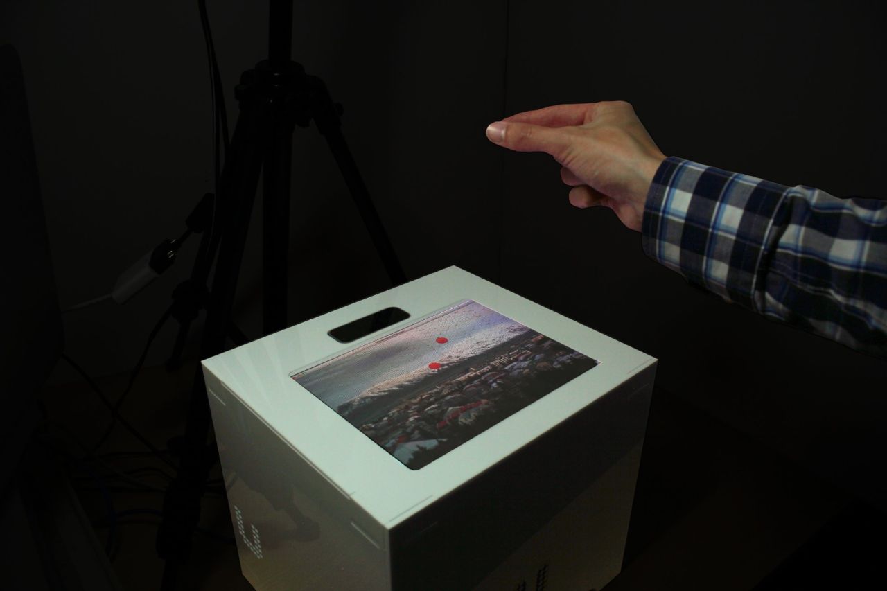 First there were buttons, then there was the touchscreen. And now there is the hands-free touchscreen. Researchers from the <a href="http://big.cs.bris.ac.uk/" target="_blank" target="_blank">Bristol Interaction and Graphics Group</a> have developed <em>UltraHaptics</em>. Users can now get tactile feedback from a touchscreen mid-air. "Waves of ultrasound displace the air, creating a pressure difference. By causing many waves to arrive at the same place simultaneously, a noticeable pressure difference is created at that point. With this method, we are able to create multiple, concurrent points of haptic feedback in mid-air."