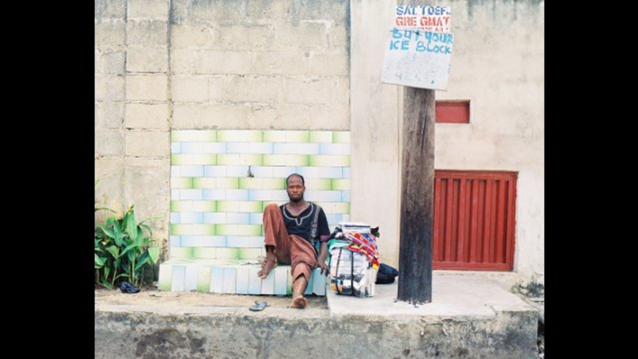 "Portrait of a Trader," by Nigerian Emeka Okereke, shows a street trader taking a short break from his work among the heavy traffic of Lagos. 