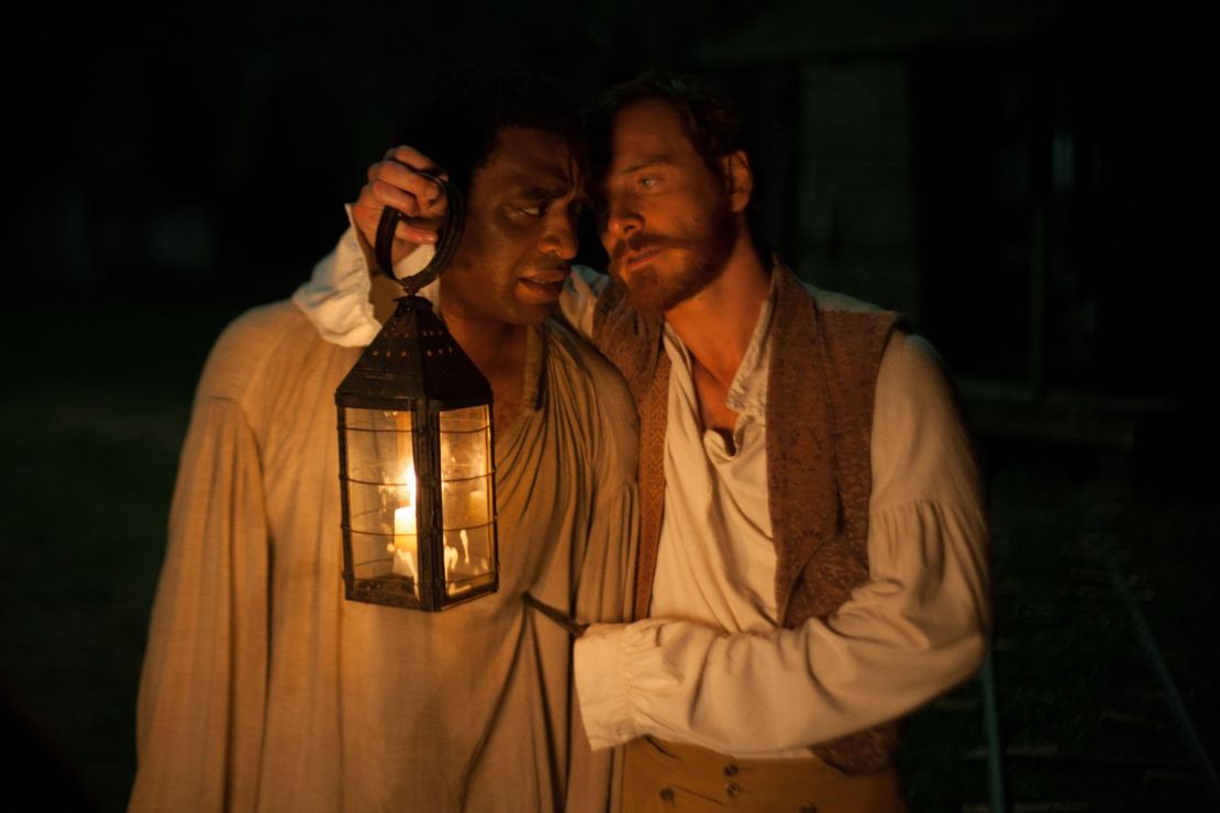 Chiwetel Ejiofor, left, stars as Solomon Northup and Michael Fassbender stars as Edwin Epps in "12 Years a Slave."

