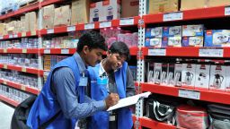 Indian employees check the products of a newly opened Bharti Wal-Mart Best Price Modern wholesale store in Hyderabad on September 26, 2012. The government last week unexpectedly revived long-delayed plans to open up the retail, aviation and broadcasting sectors to more foreign investment and reduced deficit-bloating fuel subsidies, after policy paralysis and graft scandals dimmed the outlook for India's once-booming economy. The government's moves, of which the boldest is allowing foreign supermarkets such as US giant Walmart to set up shop in India, have prompted nationwide protests. AFP PHOTO / Noah SEELAM (Photo credit should read NOAH SEELAM/AFP/GettyImages)