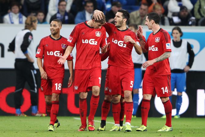 Kiessling clearly has mixed feelings as he is congratulated by teammates after the controversial award of the goal. 
