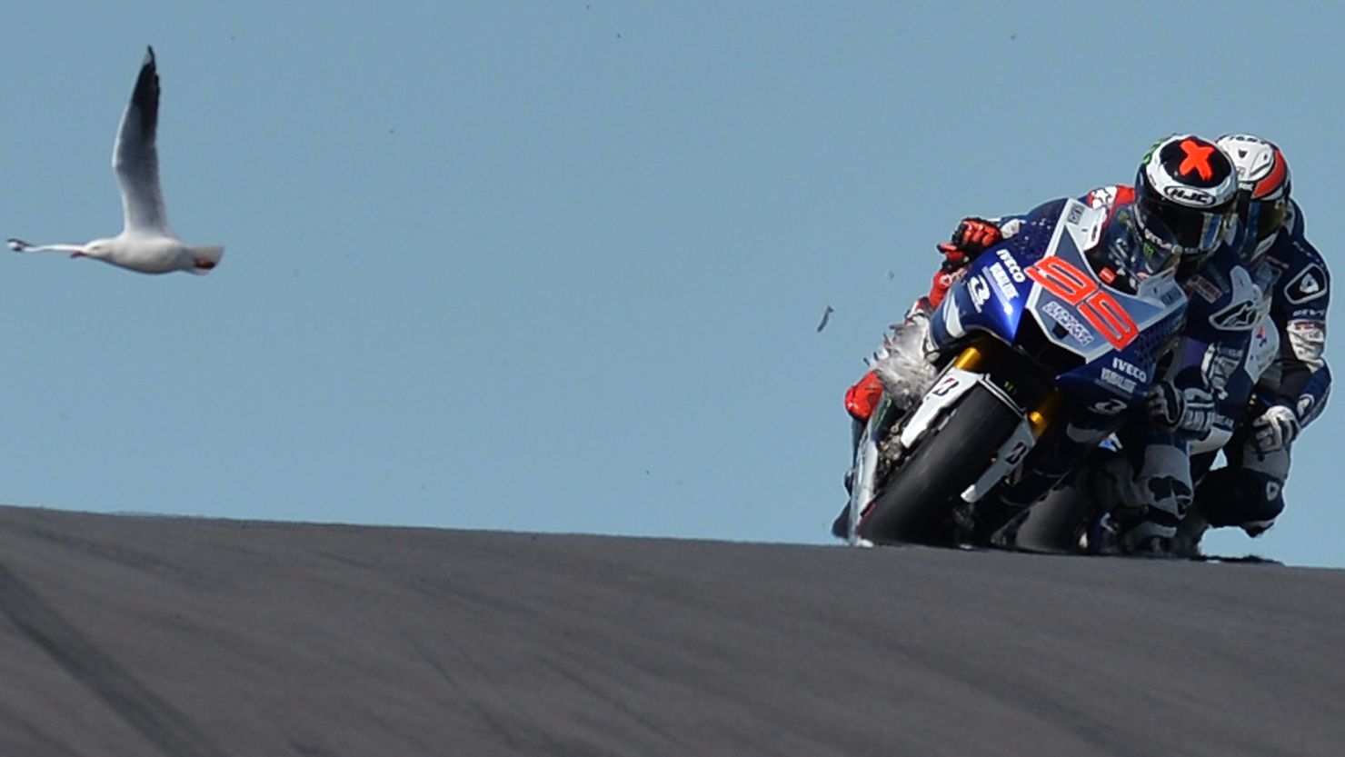 A seagull gets trapped in the forks of Jorge Lorenzo's Yamaha, while another flies in the background at the top of Lukey Heights.