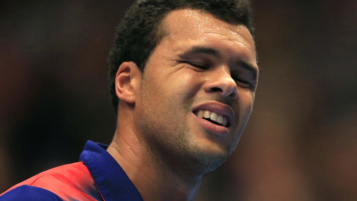 French tennis player Jo-Wilfried Tsonga grimaces during his semifinal defeat by Robin Haase in Vienna.
