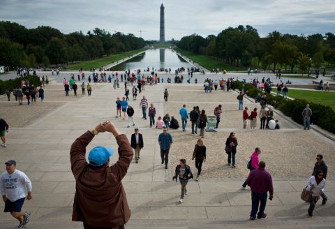 Tourists flock to memorials in Washington on Saturday, October 19, the first weekend after the end of the partial government shutdown. The Washington Monument and other landmarks across the country have reopened to the public after the 16-day shutdown. The government impasse ended when President Barack Obama signed a spending and debt ceiling agreement that Congress passed, averting a possible default. 