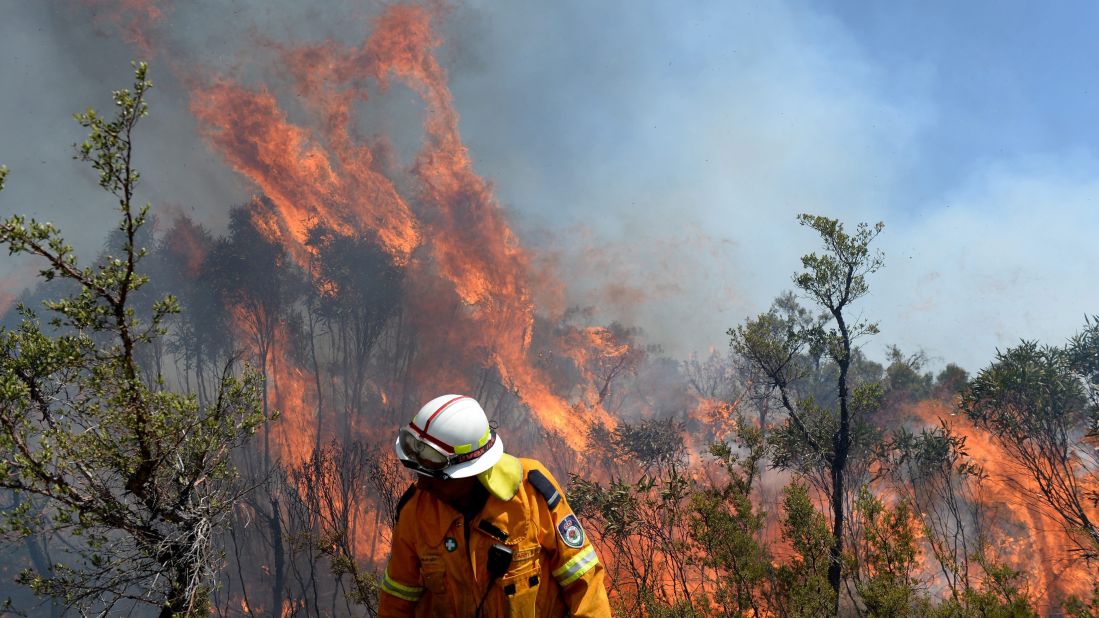 A firefighter puts in containment lines on the Darling Causeway, near Bell, Australia, on October 21.