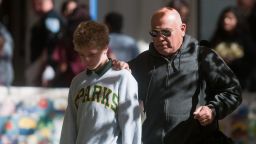 SPARKS, NV - OCTOBER 21:  A parent escorts his child from Agnes Risley Elementary school following a shooting at nearby Sparks Middle School October 21, 2013 in Sparks, Nevada. A staff member was killed and two students were injured after a student opened fire at the Nevada middle school. The suspected gunman was also killed. Students from the middle school were evacuated and held for parents at the elementary school.  (Photo by David Calvert/Getty Images)