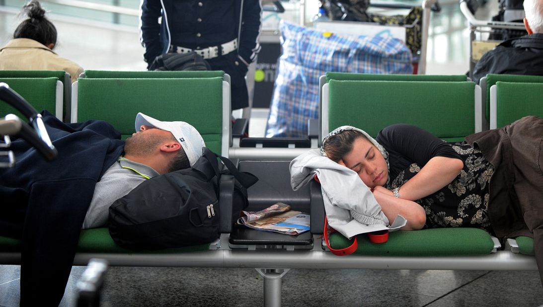 "There are a few 'beds' made of four seats together (no armrests)," writes one airport sleeper ecstatically.
