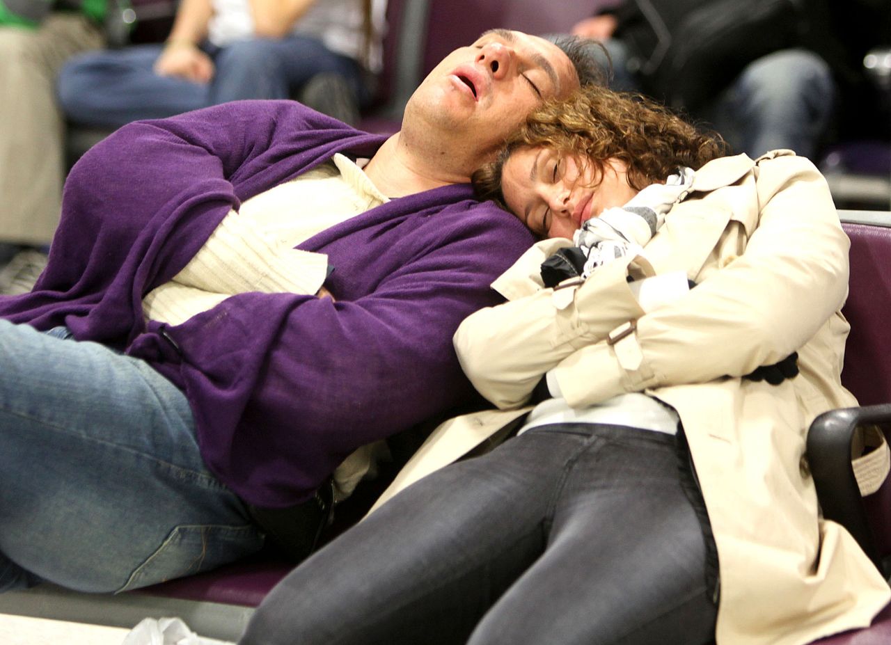 <strong>Least convenient -- No.10: Edinburgh: </strong>These Edinburgh Airport passengers pictured in 2011 have the right idea. The $6 transfer to town will take 30 minutes -- enough time for a bit of shut-eye. 