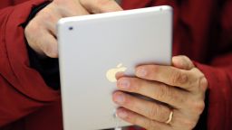 A man uses a new iPad mini during the opening of a new Apple store on November 15, 2012 in Saint-Herblain, western France.    AFP PHOTO / JEAN-SEBASTIEN EVRARD        (Photo credit should read JEAN-SEBASTIEN EVRARD/AFP/Getty Images)